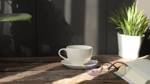 Slow motion hot coffee and espresso mug shot in cozy environment with hot tea Stock Footage 296997819