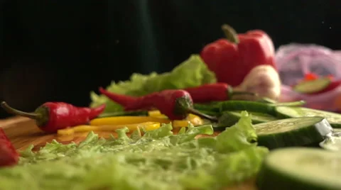 Slow Motion Hot Pepper Fall on cutting board Stock-Footage 68672617