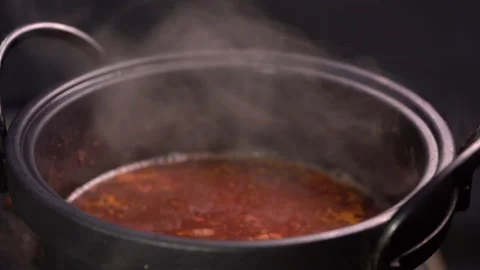 Slow motion hot soup in pot for cooking seafood  on party  Stock Footage 130533871