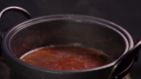 Slow motion hot soup in pot for cooking seafood  on party  動画素材 130534418