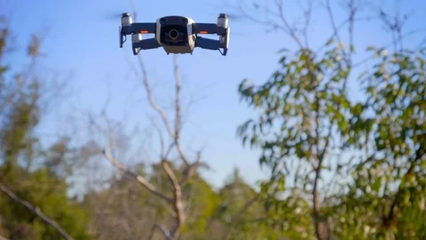 Slow motion hover of white mavic air Stock Footage 112473275