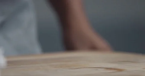Slow motion of how black man makes a roll of dough from a ball Stock Footage 75193913