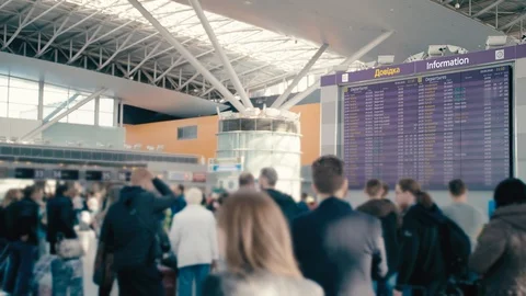 Slow Motion Huge information board at the international airport. Around him are Stock Footage 106817586