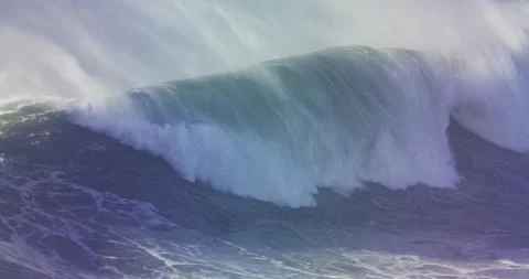 Slow motion of huge ocean wave picking up on height and speed towards seashore Stock Footage 155800695