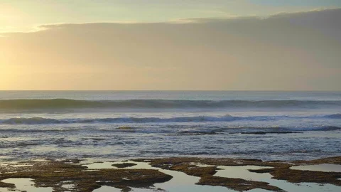 Slow motion of huge waves with splashes in high tide beach with brown sea floor Video stock 114819672