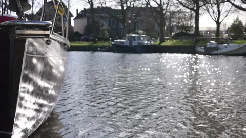Slow motion hull reflections shimmering beside the mooring Video stock 331840477