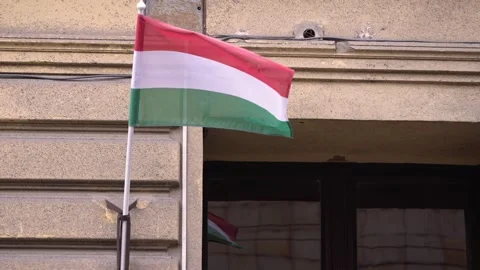 Slow motion of Hungarian flag billowing on building in Budapest, close-up view Stock Footage 290477366
