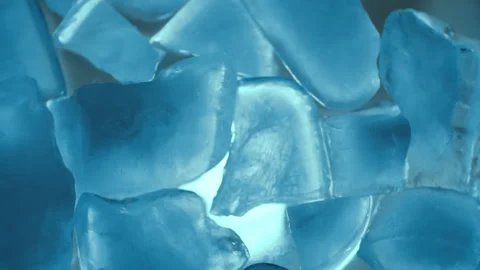 Slow motion of ice crystal pieces with blue backlight. Flicker of light. Stock Footage 262750252