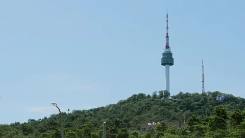 Slow motion of iconic tower on green hill in Seoul Stock Footage 314073931