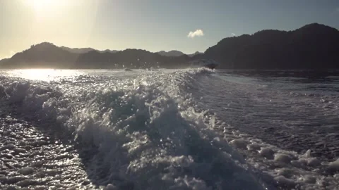 Slow-motion image of speed boat cruising water near Fiji island. Stock Footage 151604262