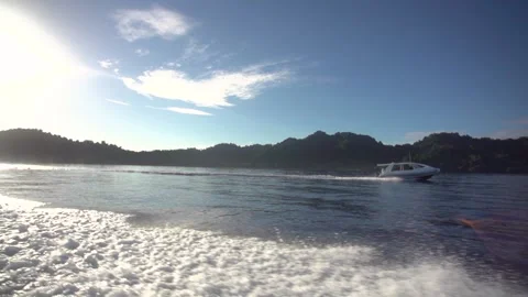 Slow-motion image of speed boat cruising water near Fiji island. Stock Footage 151604322