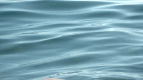 Slow motion image of water flowing from the palms of a girl Sea Waves Stock Footage 114037886