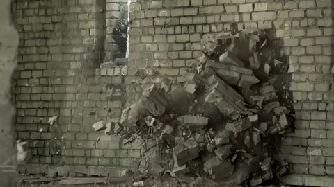 Slow Motion Impact Destroying Industrial Brick Wall With Flying Debris Stock Footage 328705072