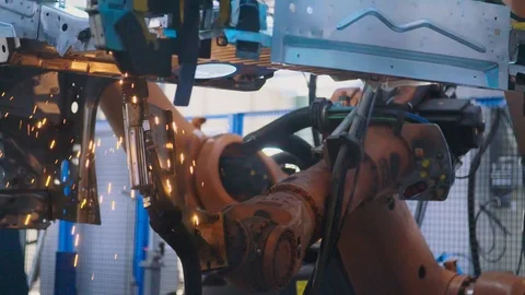 Slow motion industrial. Robots welding on a car factory production line Video stock 88700934
