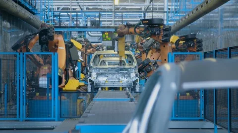 Slow motion industrial. Robots working on a car factory production line Video stock 88700999