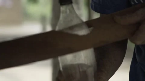 Slow Motion Installation of Moser Lamp Solar Bottle Light on Roof Tile Stockbeeldmateriaal 320571359