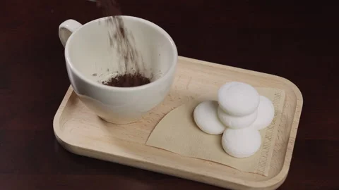 Slow Motion of Instant Coffee Pieces Falling From Spoon in Coffee Cup. coff.. Stock Footage 322553764