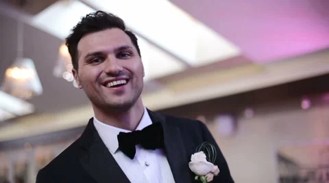 SLOW MOTION: Intelligent handsome man in a tuxedo dancing at a party Stock Footage 43412919