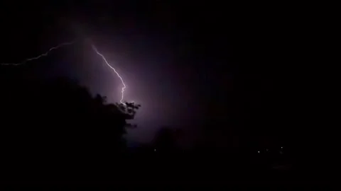 Slow motion Intense lightning storm lights up the night before monsoon rains Stock Footage 337147837