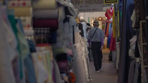 Slow motion of interior stalls and local shoppers at Gwangjang Market Stock Footage 314072758