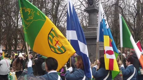 Slow-motion of Irish flags at a St. Patrick's Day parade at Glasgow Green. Stock-Footage 332810098