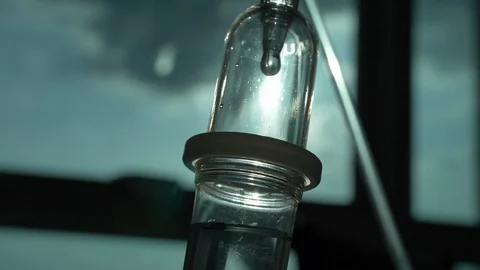 Slow motion, iv drip saline solution of medical Stock Footage 125412762