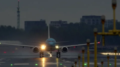 Slow motion of a jet taking off during rain Video stock 288703299