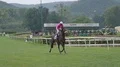 Slow motion jockey with racehorse riding close up after the race HD Footage