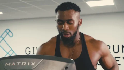 Slow motion jogging on a treadmill in the gym. Personal trainer/fitness model Stock Footage 89577345