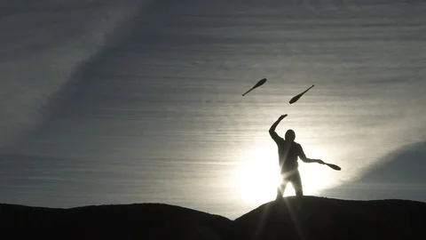 Slow Motion Juggling Batons Silhouette Against The Sky Video stock 101283495
