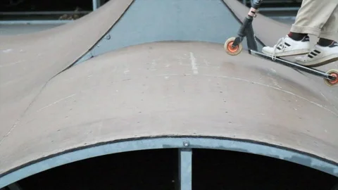 Slow-motion jump on a scooter Stock Footage 113696766