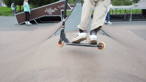 Slow-motion jump on a scooter Stock Footage 113696781