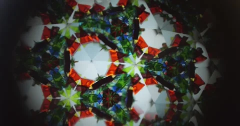 Slow Motion of Kaleidoscope with Triangular Mirror Tube creating Optical Video stock 330955807