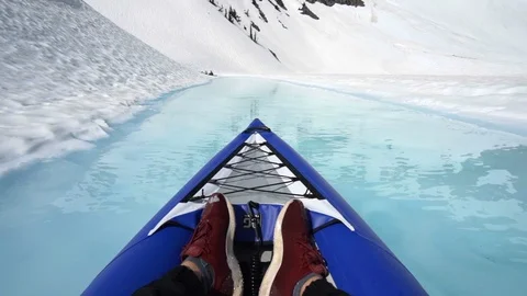 Slow Motion of Kayaking on Bright Blue Water in Beautiful Snowy Landscape in Stock Footage 113944110