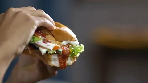 Slow Motion of ketchup dripping off of a hamburger Stock Footage 128002533