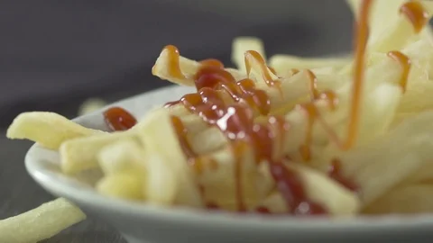 Slow Motion Ketchup Drizzle Over French Fries 스톡 동영상 72810461