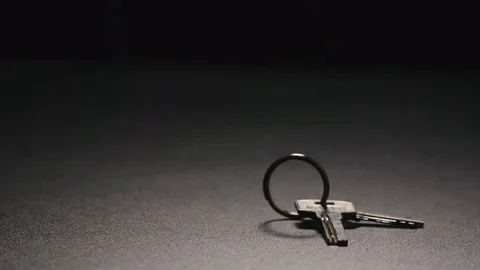 SLOW MOTION: Keys fall on a floor Stock Footage 72273420