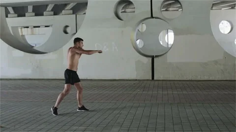 Slow motion. Kick-boxer is training punching. Stock Footage 68758118