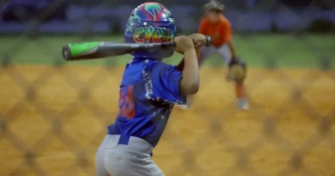Slow motion of kid batting and running during baseball game Video stock 75962207