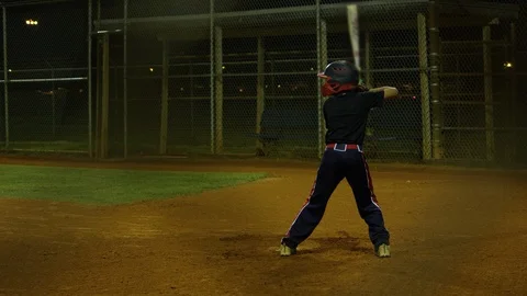 Slow motion of kid batting during baseball practice Stock Footage 106273505