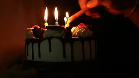 Slow motion kid blowing fire candle on cake of happy birth day cake on night Vídeos de archivo 236839798