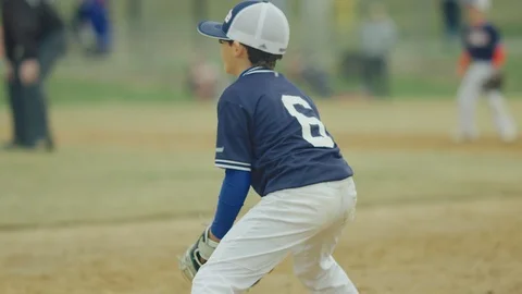Slow motion of a kid running during a baseball game Stock Footage 115924972