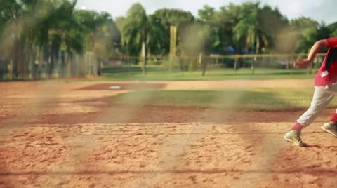 Slow motion of kid running to first base during baseball practice Video stock 63286426
