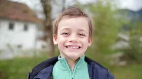 Slow motion of kid smiling in camera Video stock 49762390