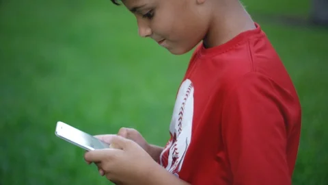 Slow motion of kid texting and then rubbing his neck with pain Stock Footage 111049535