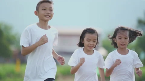 Slow motion kids playing and running on nature of countryside Stock Footage 132917283