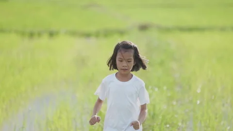 Slow motion kids playing and running on nature of countryside Stock Footage 132918485