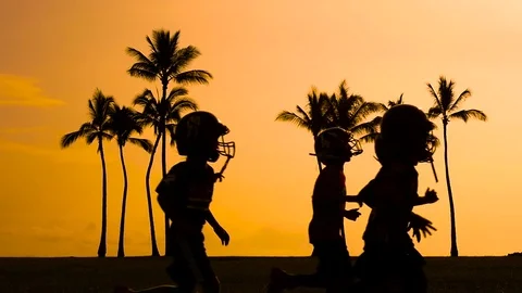 Slow Motion Kids practicing and learning American football from trainers Stock Footage 74683846