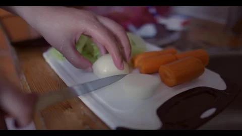 Slow Motion Knife Cutting FreshOnion on Wooden Cutting Board Stock Footage 341444538