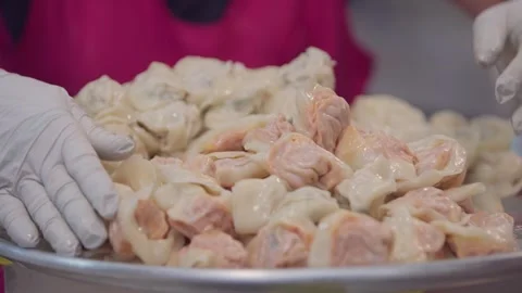 Slow motion of Korean dumplings being prepared at Gwangjang Market Stock Footage 313674799